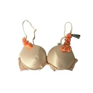 gorgeous satin nude bra with floral designs on the strap 🤎